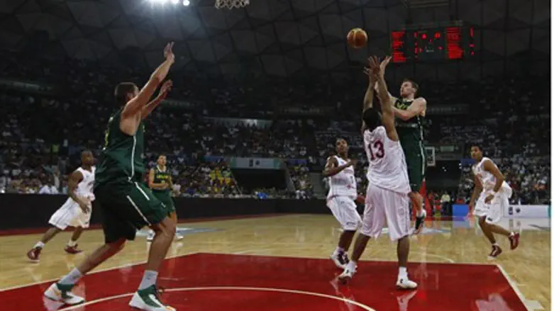 Lithuania's Martynas Pocius (R) goes for a ba