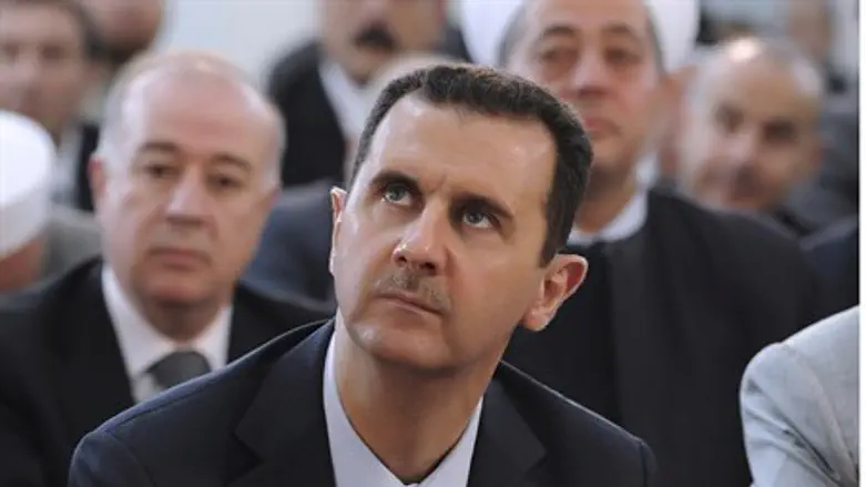 Assad attends Eid Al Fitr prayers