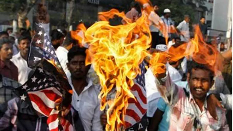  Muslim demonstrators burn U.S. flags during 