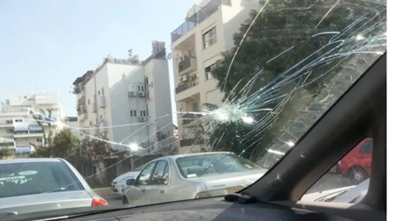 Vehicle damaged by rock attack
