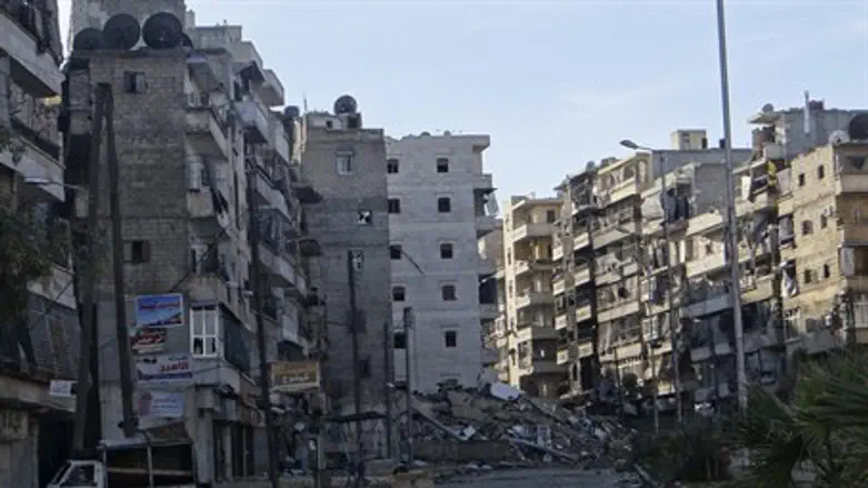 Damages on an empty street in the Aleppo dist