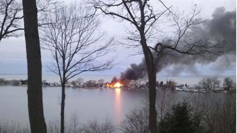A fire burns on Lake Road in Webster
