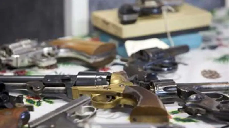 Handguns turned in are seen during a gun buyb