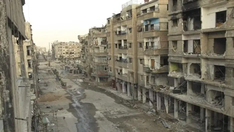 Buildings damaged by missiles fired by Syrian