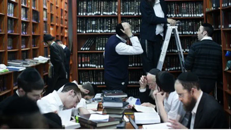 Hareidi men study Torah in the Mir yeshiva