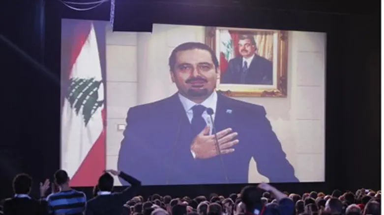 Saad al-Hariri greets his supporters via a te