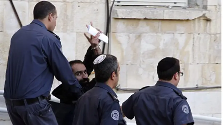 Samer Issawi gestures as he leaves the Jerusa