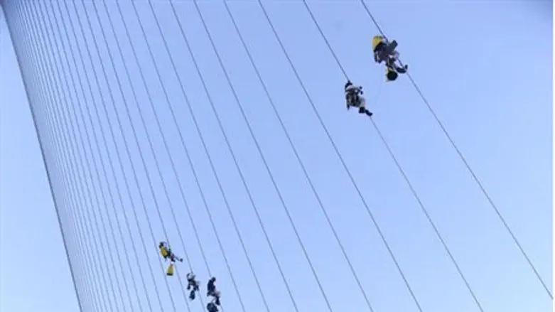 climbing the string bridge (archive)
