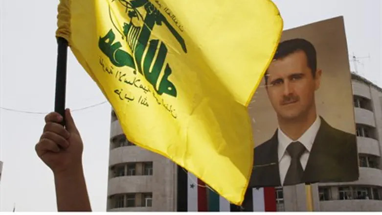 Hezbollah supporters show support for Assad