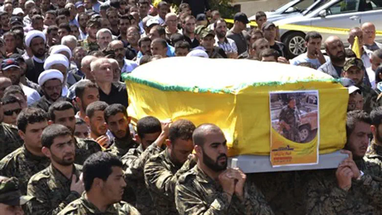Hezbollah terrorists carry coffin of operative killed in Syria fighting (file)