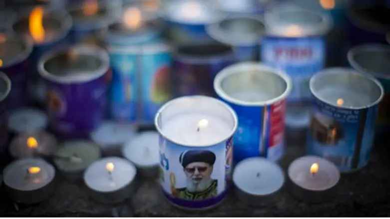 Memorial candles at grave of Rabbi Ovadiah Yo