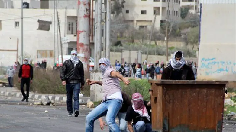 Arab rioters throwing rocks (Illustrative)