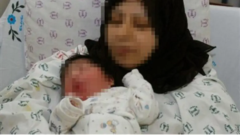 Muslim mother, baby (file)