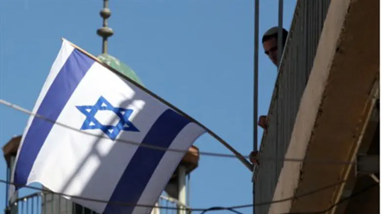 Israeli flag in front of minaret