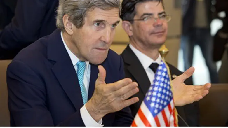 John Kerry gestures during meeting in Algiers