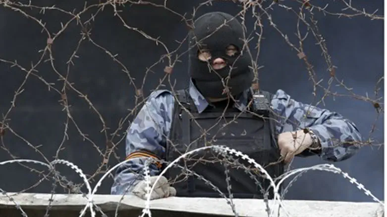 Pro-Russian militiaman behind a barricade at 
