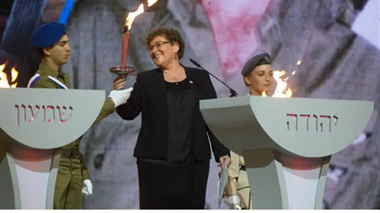 Miriam Peretz lights a torch