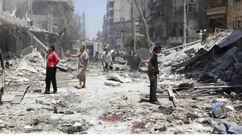 Damage from barrel bomb in Aleppo's district 