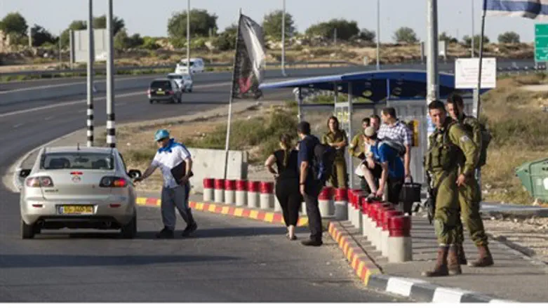 IDF soldiers guard hitchhiking posts followin
