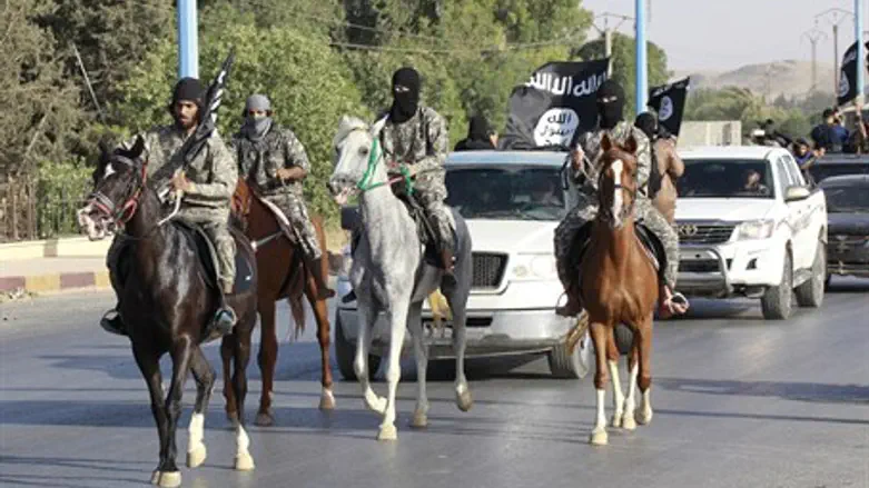 Islamic State terrorists parade through Raqqa