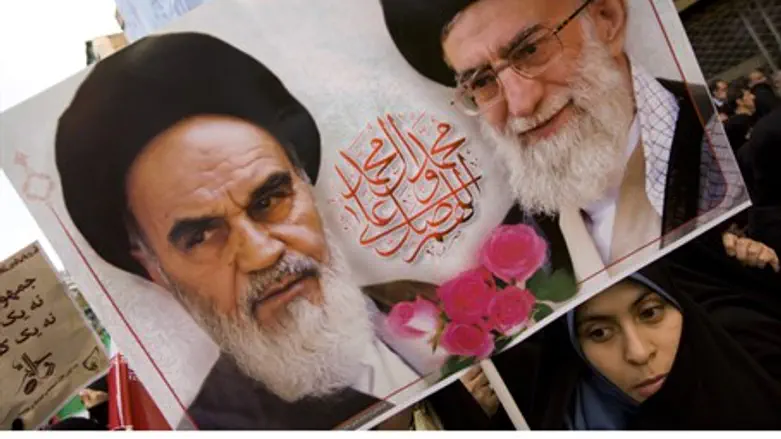 Insulting Ayatollahs Khomeini (L) or Khamenei