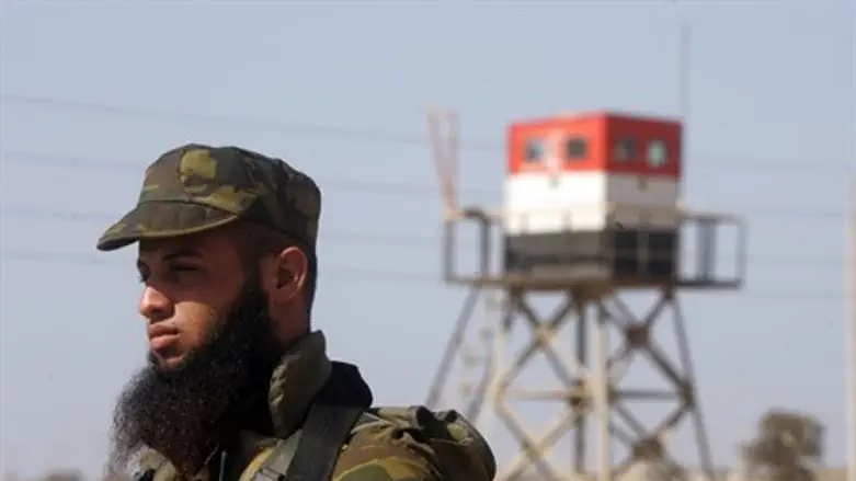 Hamas guard with Egyptian border post