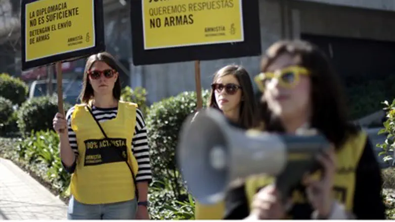 Amnesty International activists protest US ar