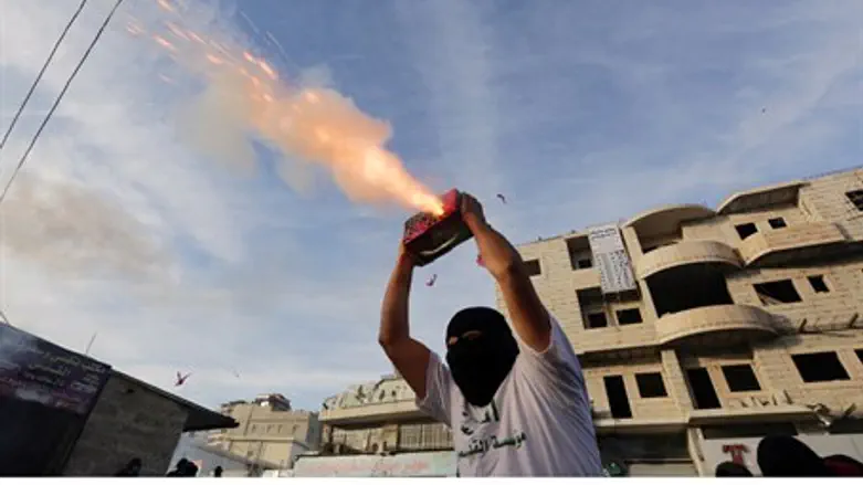 Arab rioter shoots fireworks at police in Jer