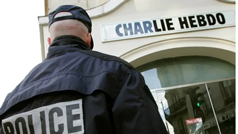 Police in front of Charlie Hebdo's Paris headquarters
