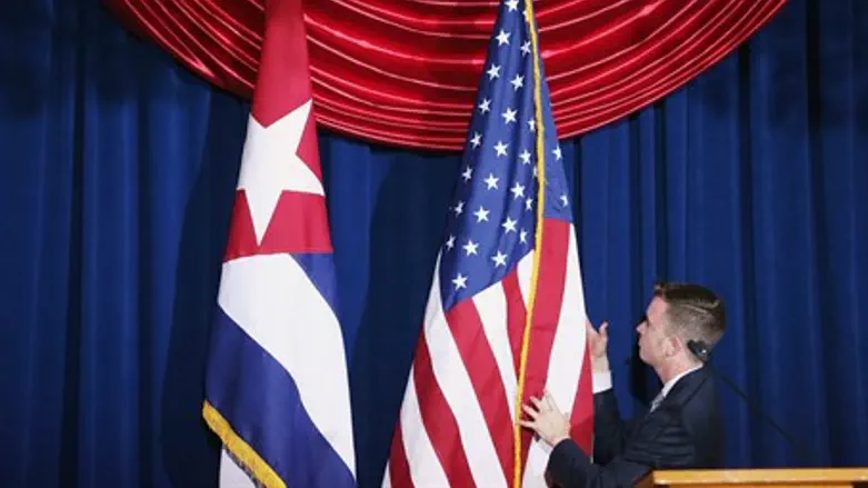 Cuban and American flags straightened during re-opening ceremony Cuban embassy in Washingt