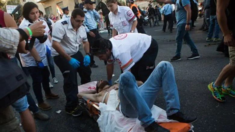 Paramedics treat victims of Jerusalem gay parade stabbing