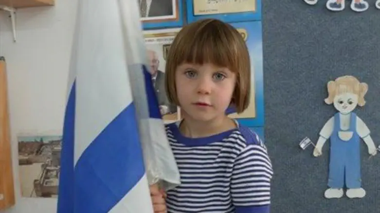 Girl holds Israeli flag at Lodz kindergarten
