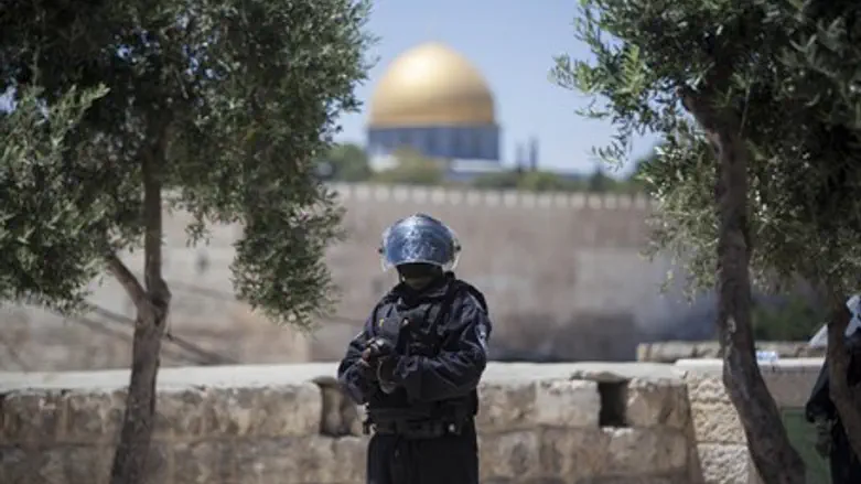 Police officer stands guard near Temple Mount