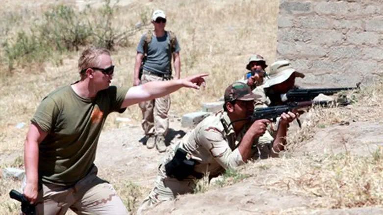 US soldier directs Kurdish forces in training exercise in Iraq