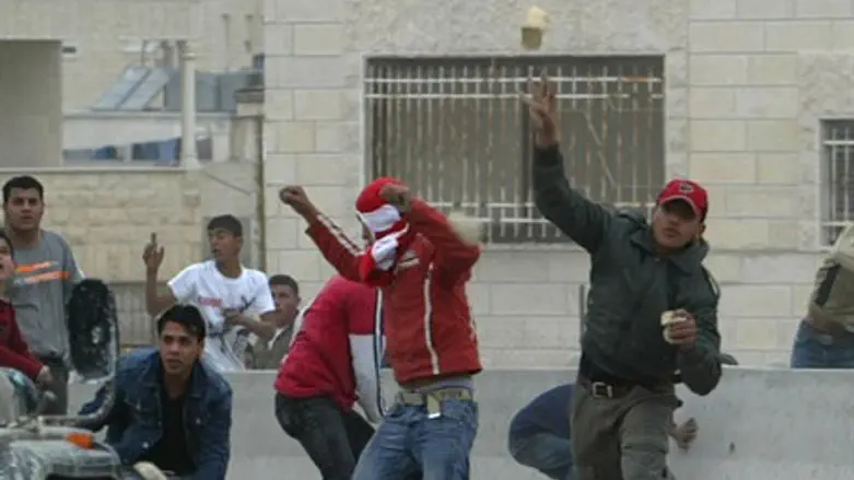 Arab rioter throws bottle (illustration)