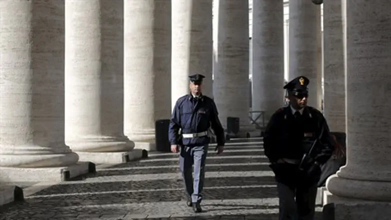 Italian police officers patrol the Vatican