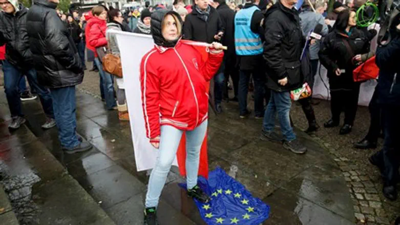 Woman stamps on EU flag