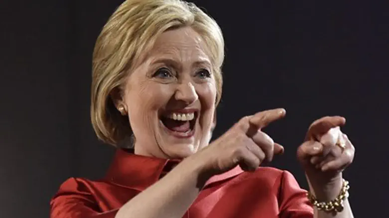 Clinton gestures to supporters after Nevada caucus