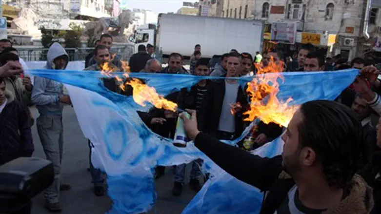 Burning Israeli flag in Ramallah