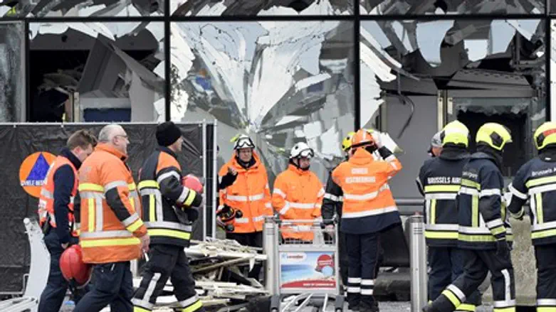 Emergency workers at the site of Brussels airport bombing