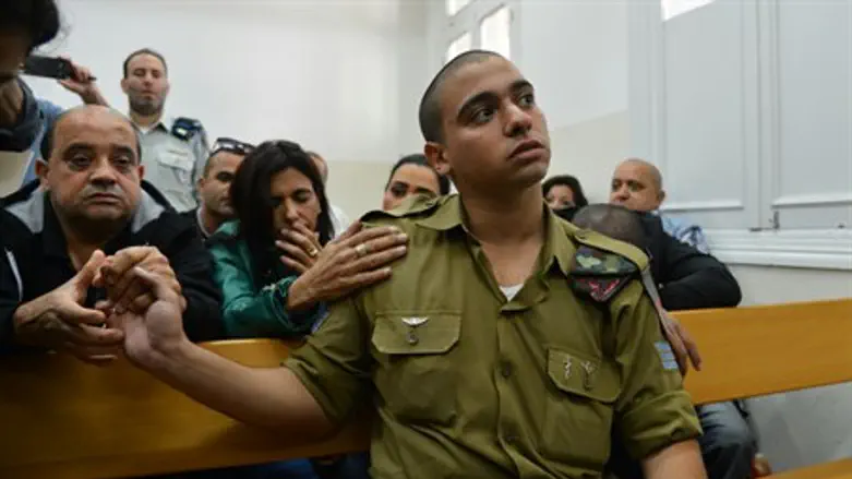 Elor Azariya in court with his parents