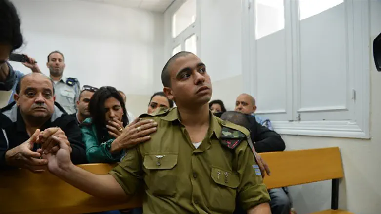 Elor Azariya in court with his parents