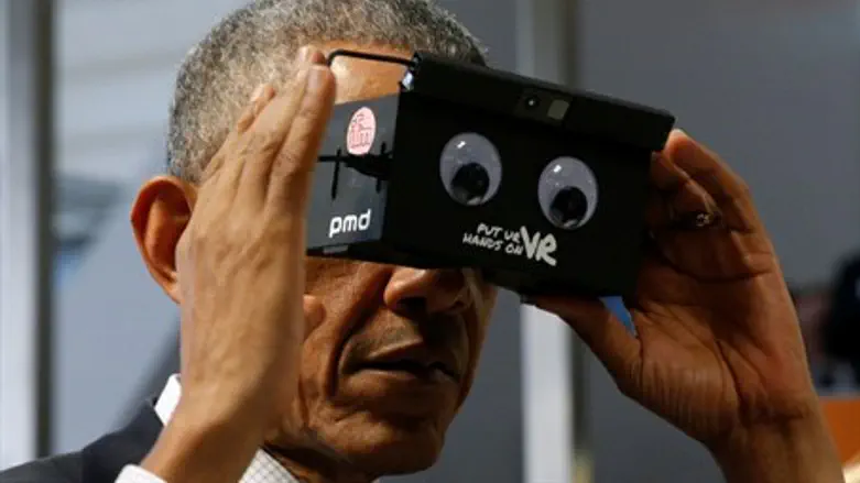 Obama tries virtual reality goggles in Germany