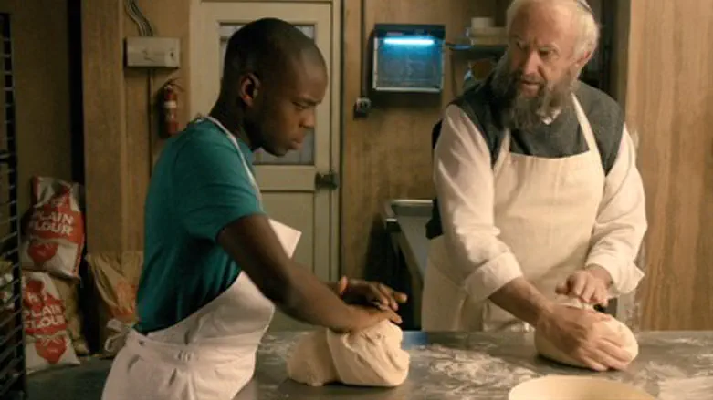 Jerome Holder, left, and Jonathan Pryce in a scene from "Dough"