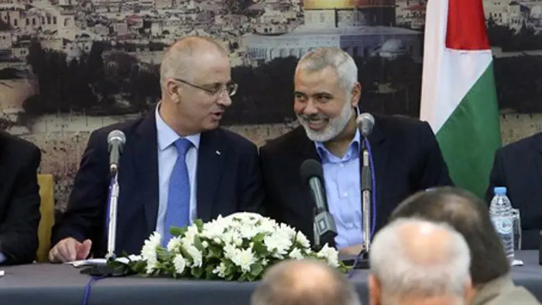 PA Prime Minister Rami Hamdallah and Hamas leader Ismail Haniyeh