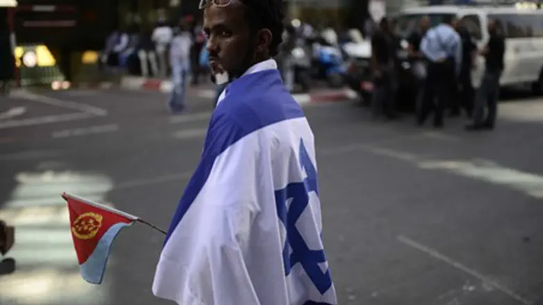 One of hundreds of Eritreans at a protest against Afeworki in Tel Aviv