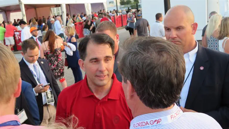 Wisconsin Gov. Scott Walker greeting attendees at the opening bash of the Republican Natio