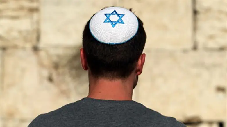 Religious Jewish man wears a kippah at the Kotel