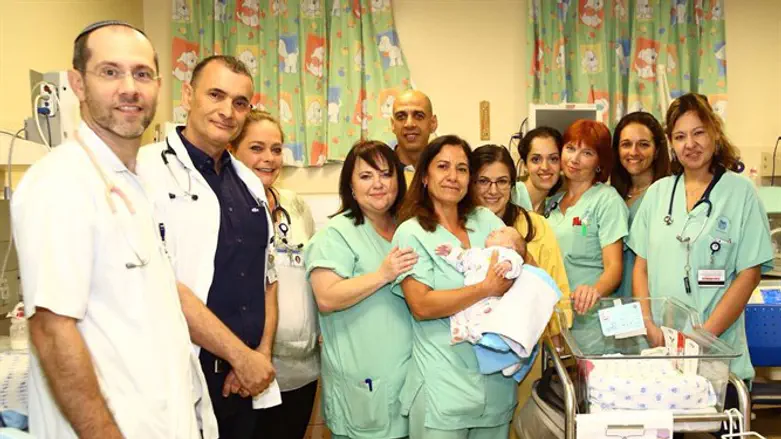The happy parents with the Ichilov neonatal team