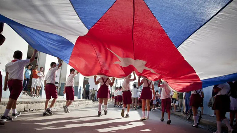 Students parade with Cuban flag in Gibara, Cuba